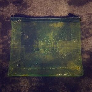 Green Urban Decay makeup bag